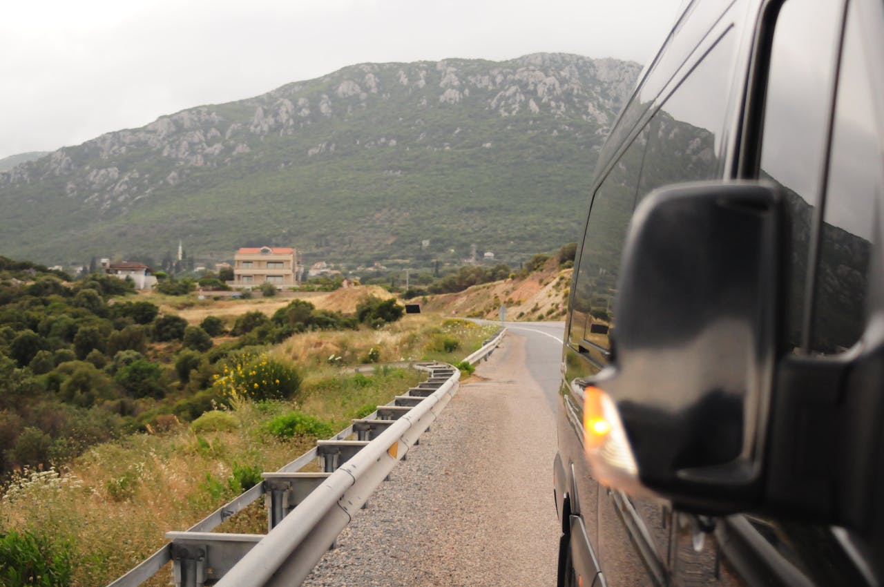 Avaleht A van reflects a scenic mountain road, capturing natural beauty and travel vibes.