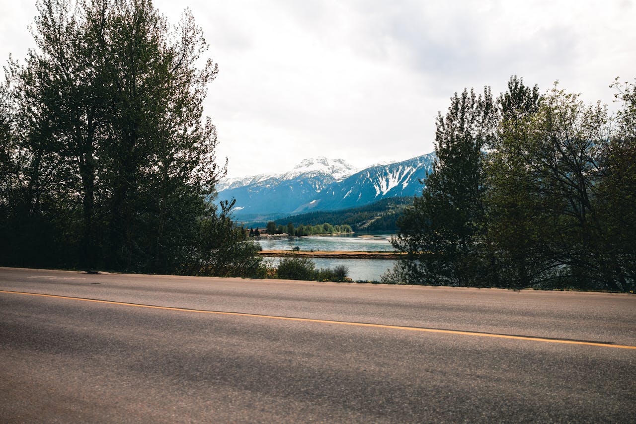 Tegemised Picturesque view of snow-capped mountains and forest near Revelstoke, BC.
